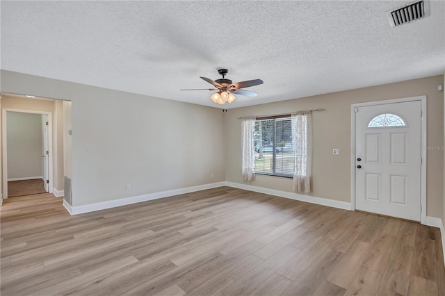 2961 Briar Cliff Dr, Palm Harbor, FL 34684 - entryway with a ceiling fan, visible vents, a wealth of natural light, and light wood finished floors