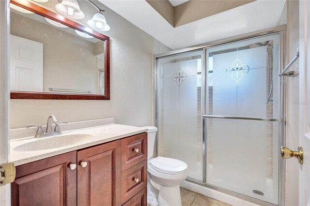 2961 Briar Cliff Dr, Palm Harbor, FL 34684 - bathroom with vanity, tile patterned flooring, a shower stall, and toilet