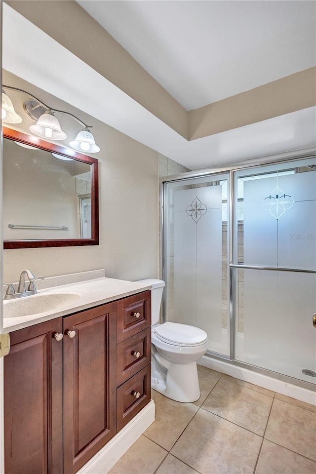 2961 Briar Cliff Dr, Palm Harbor, FL 34684 - bathroom with vanity, toilet, tile patterned flooring, and a stall shower