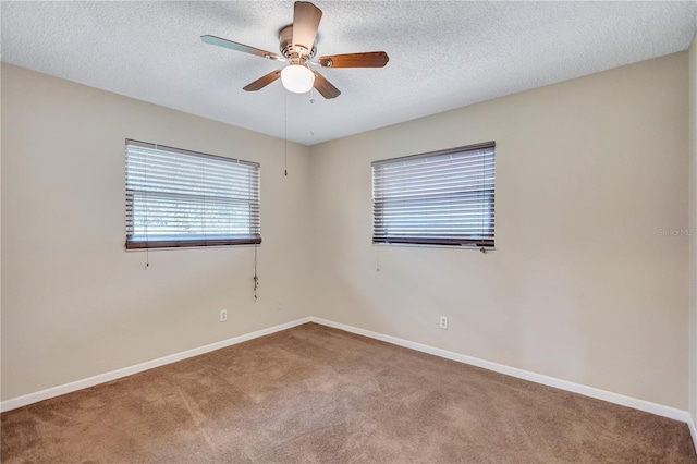 2961 Briar Cliff Dr, Palm Harbor, FL 34684 - carpeted empty room featuring a ceiling fan, baseboards, and a textured ceiling