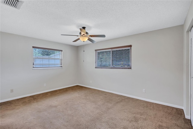2961 Briar Cliff Dr, Palm Harbor, FL 34684 - empty room with ceiling fan, visible vents, baseboards, and carpet