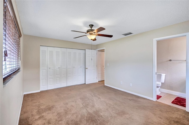 2961 Briar Cliff Dr, Palm Harbor, FL 34684 - unfurnished bedroom with carpet floors, baseboards, visible vents, and a closet