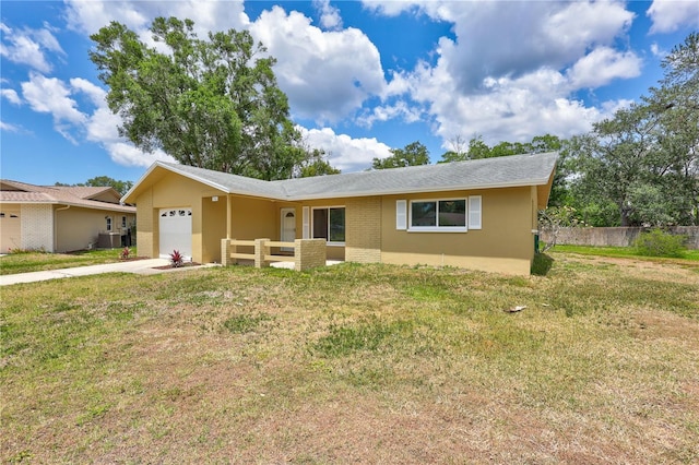 2961 Briar Cliff Dr, Palm Harbor, FL 34684 - single story home featuring fence, an attached garage, driveway, and a front lawn