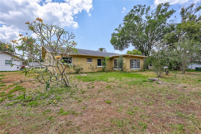 2961 Briar Cliff Dr, Palm Harbor, FL 34684 - rear view of property featuring stucco siding