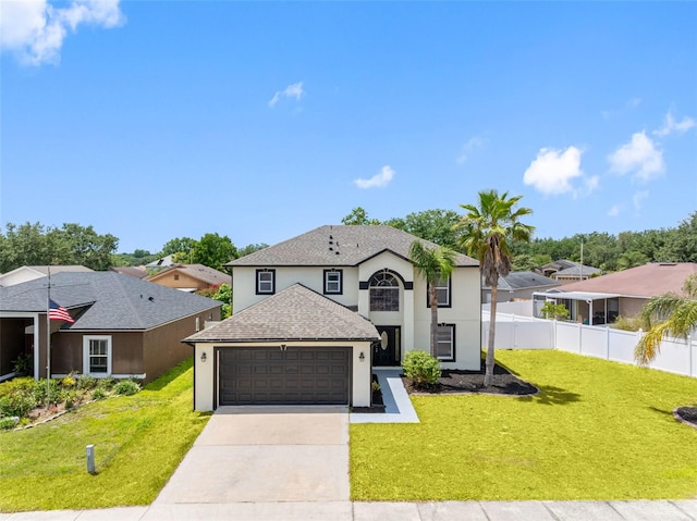 traditional home with fence, a front lawn, a garage, stucco siding, and concrete driveway