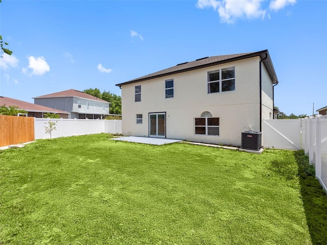 back of property with cooling unit, a patio, a fenced backyard, stucco siding, and a lawn