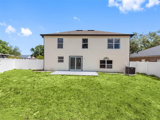rear view of property with a lawn, a patio, a fenced backyard, and stucco siding