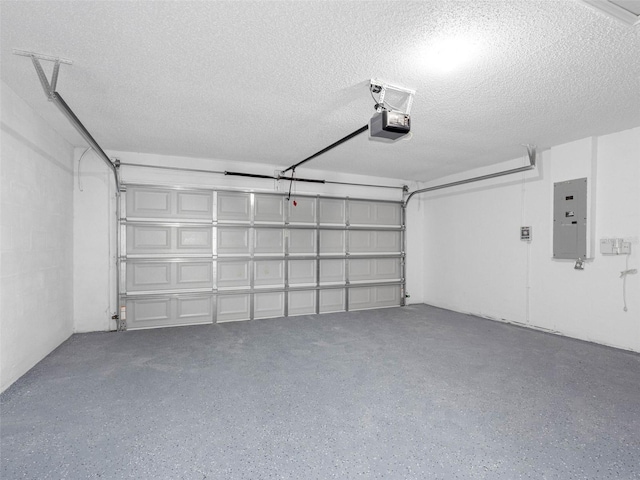 garage with a garage door opener and electric panel