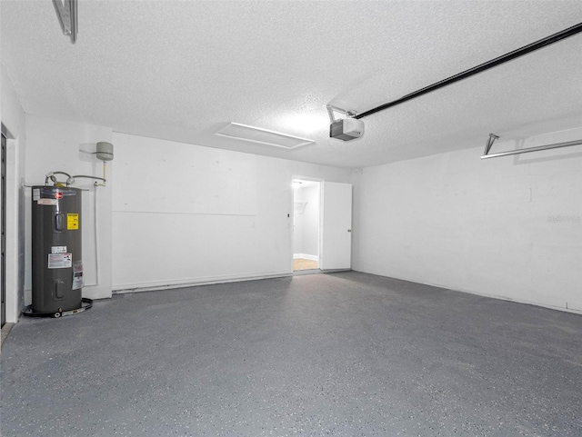 garage featuring a garage door opener and electric water heater
