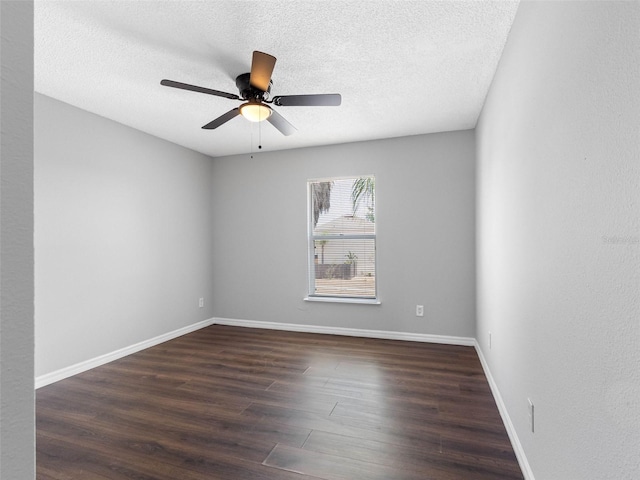 unfurnished room featuring a textured ceiling, baseboards, a ceiling fan, and wood finished floors