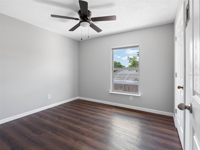 spare room featuring baseboards, a textured ceiling, ceiling fan, and wood finished floors