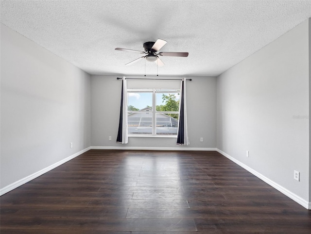 unfurnished room featuring a ceiling fan, a textured ceiling, and dark wood finished floors