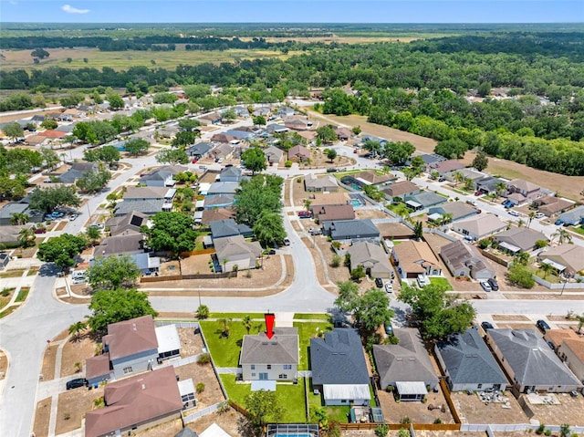 birds eye view of property with a residential view