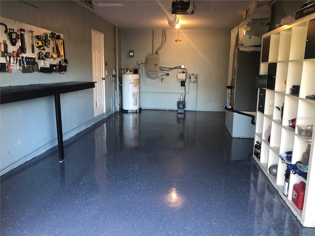 garage featuring electric panel, a garage door opener, and electric water heater