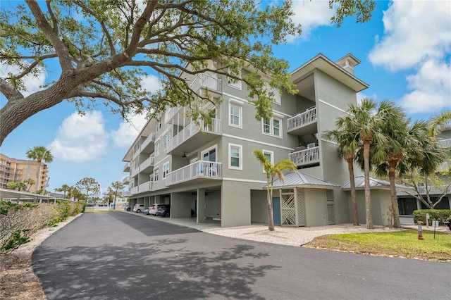 7 Island Park Pl Unit 204, Dunedin, FL 34698 - view of apartment building / complex featuring covered parking