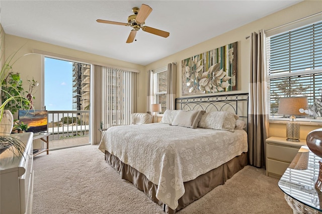 7 Island Park Pl Unit 204, Dunedin, FL 34698 - carpeted bedroom featuring access to outside and ceiling fan