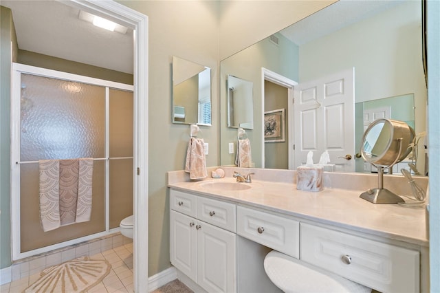7 Island Park Pl Unit 204, Dunedin, FL 34698 - full bathroom with toilet, vanity, tile patterned floors, and an enclosed shower