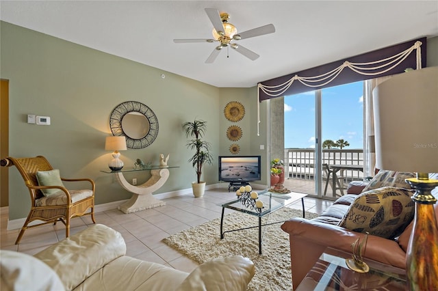 7 Island Park Pl Unit 204, Dunedin, FL 34698 - tiled living area featuring a ceiling fan and baseboards