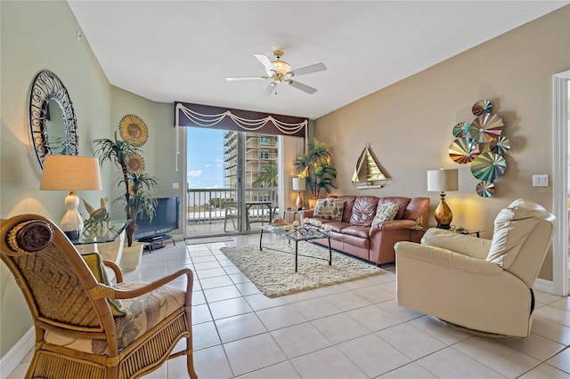 7 Island Park Pl Unit 204, Dunedin, FL 34698 - living area featuring ceiling fan, light tile patterned floors, and baseboards