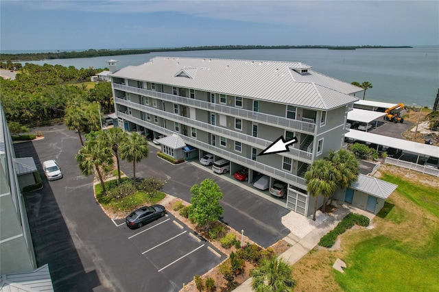7 Island Park Pl Unit 204, Dunedin, FL 34698 - drone / aerial view of a large body of water and apartment complex / building
