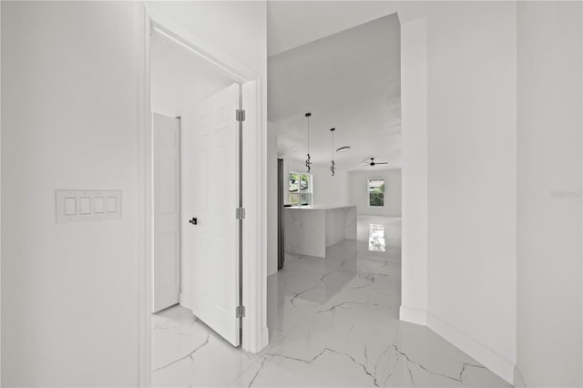 3803 E Curtis St, Tampa, FL 33610 - hall featuring light marble finish floors and baseboards