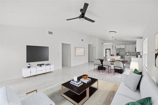 3803 E Curtis St, Tampa, FL 33610 - living room featuring lofted ceiling, light marble finish floors, and ceiling fan