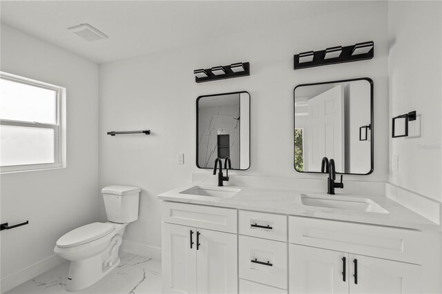 3803 E Curtis St, Tampa, FL 33610 - full bath with baseboards, toilet, double vanity, and marble finish floors
