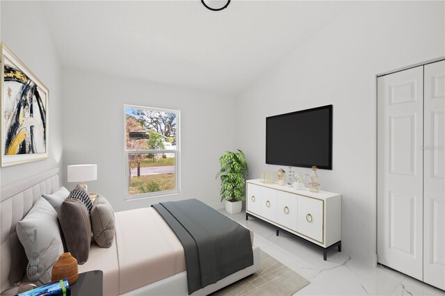 3803 E Curtis St, Tampa, FL 33610 - bedroom with light marble finish flooring and vaulted ceiling