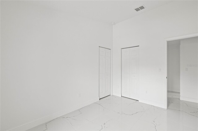 3803 E Curtis St, Tampa, FL 33610 - unfurnished room with light marble finish floors and baseboards