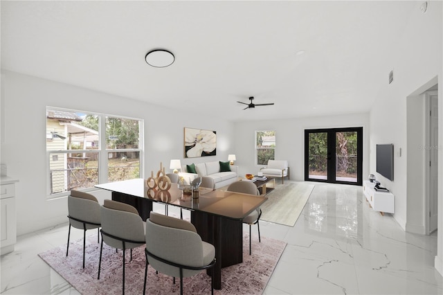 3803 E Curtis St, Tampa, FL 33610 - dining area with light marble finish flooring, plenty of natural light, and a ceiling fan