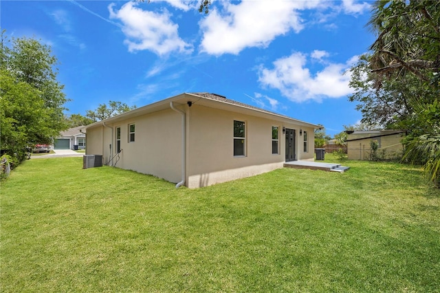 3803 E Curtis St, Tampa, FL 33610 - back of property featuring stucco siding and central AC unit