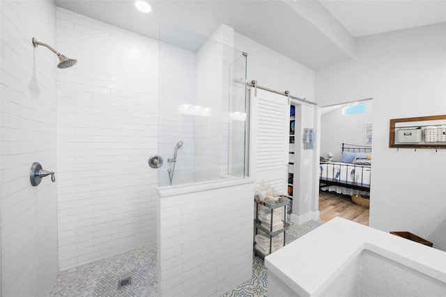 ensuite bathroom featuring a walk in shower, recessed lighting, and connected bathroom