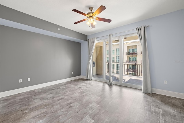 1227 E Madison St Unit 902, Tampa, FL 33602 - unfurnished room with ceiling fan, wood finished floors, and baseboards