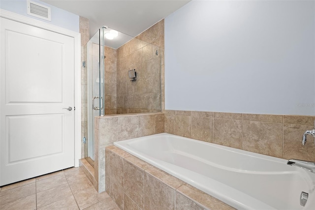 1227 E Madison St Unit 902, Tampa, FL 33602 - bathroom featuring a shower stall, a bath, and tile patterned flooring