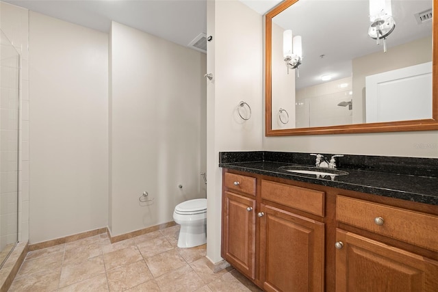 1227 E Madison St Unit 902, Tampa, FL 33602 - full bathroom with a tile shower, toilet, vanity, and baseboards