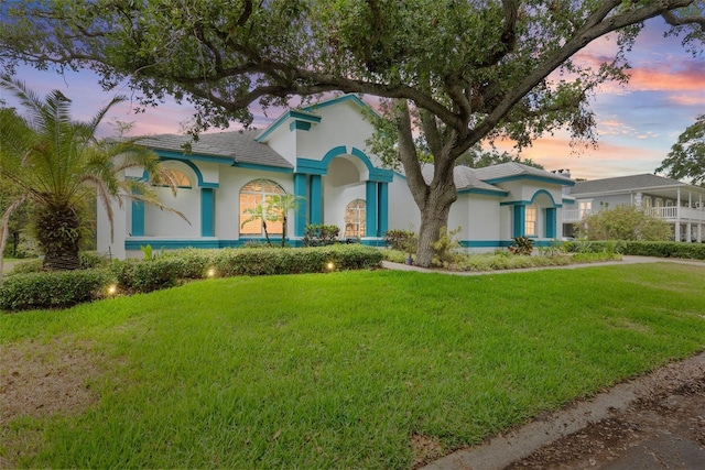 7314 Hunt Club Ln, Seminole, FL 33776 - mediterranean / spanish-style house with a lawn and stucco siding