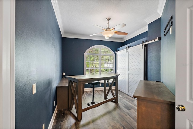 7314 Hunt Club Ln, Seminole, FL 33776 - office with a barn door, ornamental molding, a textured wall, dark wood-type flooring, and a ceiling fan