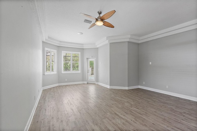 7314 Hunt Club Ln, Seminole, FL 33776 - spare room with a ceiling fan, wood finished floors, and baseboards