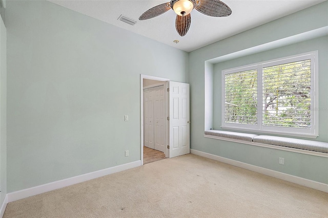 7314 Hunt Club Ln, Seminole, FL 33776 - unfurnished bedroom featuring carpet flooring, baseboards, and ceiling fan