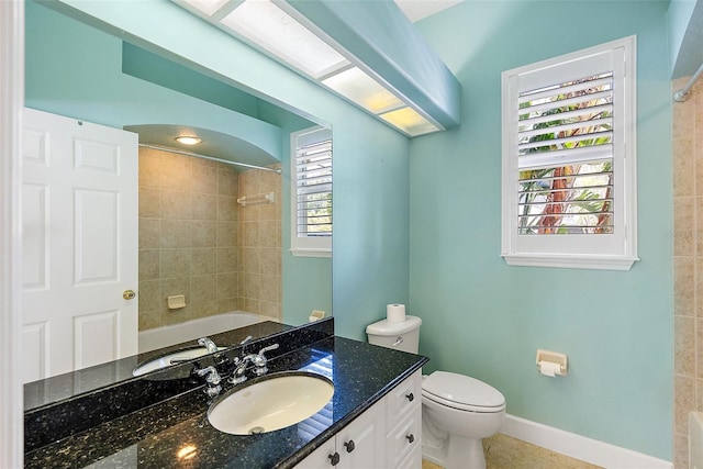 7314 Hunt Club Ln, Seminole, FL 33776 - bathroom featuring vanity, toilet, bathtub / shower combination, and baseboards