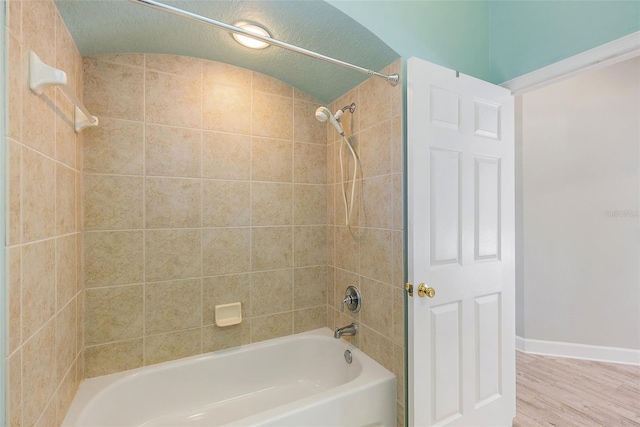 7314 Hunt Club Ln, Seminole, FL 33776 - full bathroom with shower / bath combination, wood finished floors, and baseboards