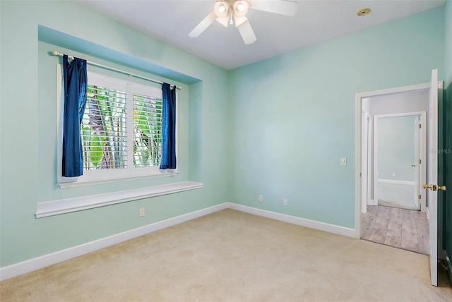 7314 Hunt Club Ln, Seminole, FL 33776 - carpeted spare room featuring baseboards and ceiling fan