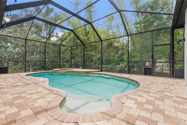 7314 Hunt Club Ln, Seminole, FL 33776 - view of swimming pool featuring a patio area, a pool with connected hot tub, and glass enclosure