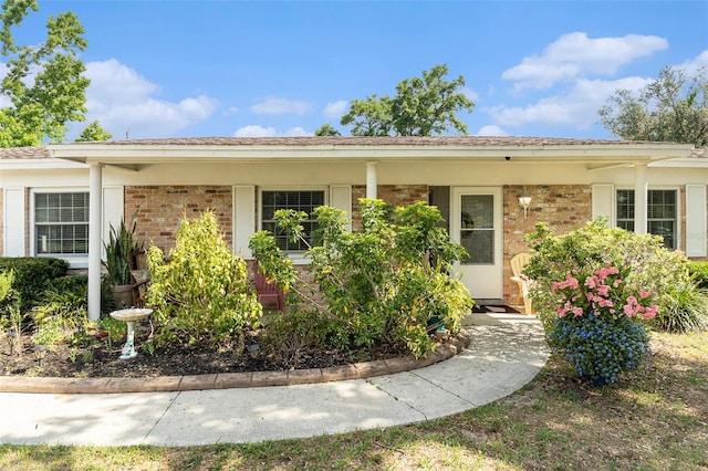 view of front of house with brick siding