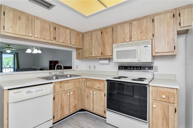 112 W Cypress Ct, Oldsmar, FL 34677 - kitchen with a sink, light brown cabinets, white appliances, light countertops, and visible vents