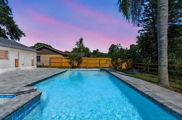 view of pool with a fenced backyard, a fenced in pool, and a patio area