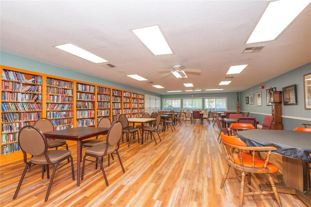 dining area featuring light wood-style flooring