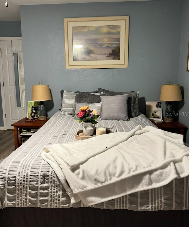 836 Magellan Dr, Sarasota, FL 34243 - bedroom with wood finished floors