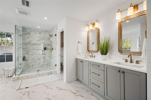 101 Ponce De Leon Blvd, Belleair, FL 33756 - full bath featuring a marble finish shower, visible vents, marble finish floor, and a sink