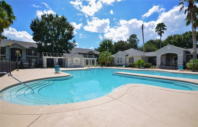3705 SW 27th St Unit 214, Gainesville, FL 32608 - community pool with a patio and a residential view